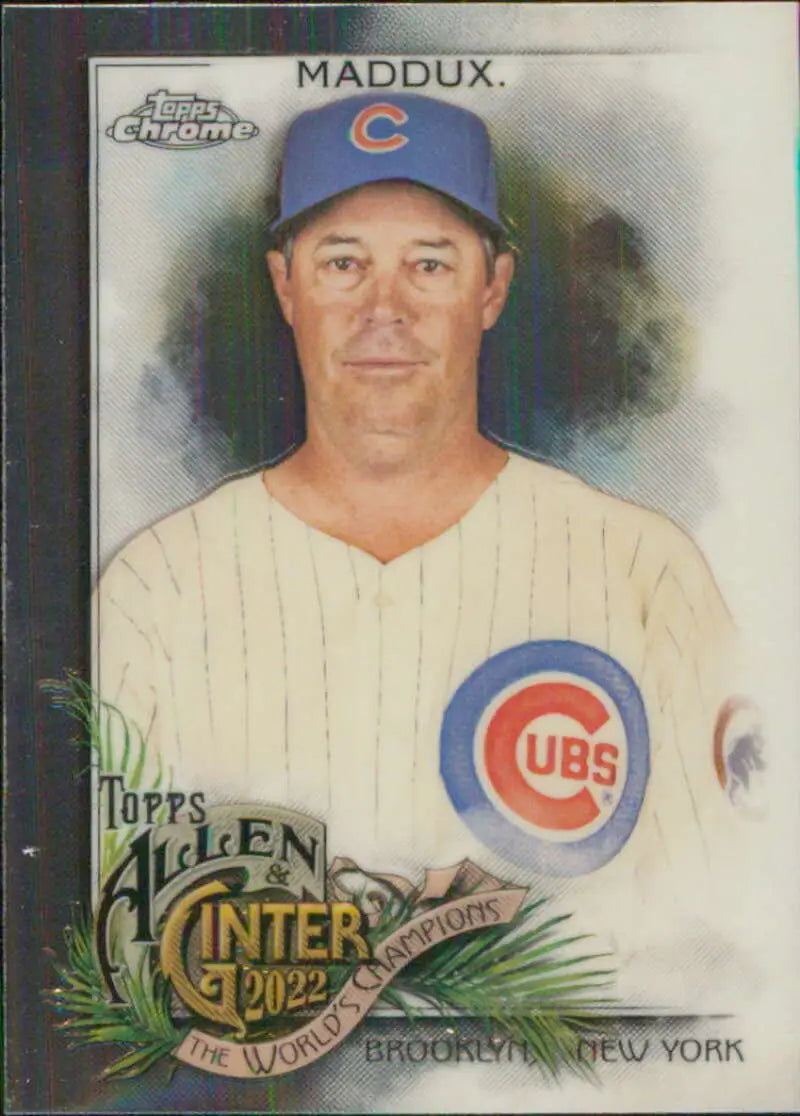 Greg Maddux Chicago Cubs baseball card in white pinstriped uniform and blue cap