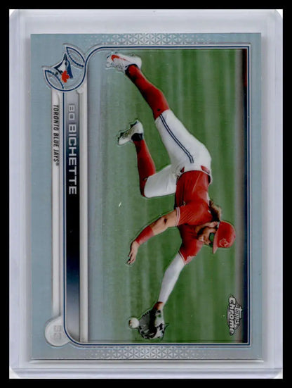 Baseball trading card of Bo Bichette making a dive in his red Toronto Blue Jays uniform