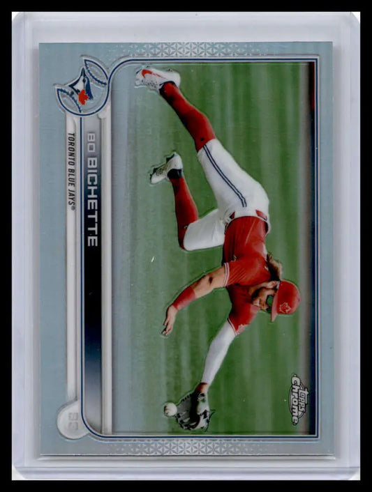 Baseball trading card of Bo Bichette making a dive in his red Toronto Blue Jays uniform