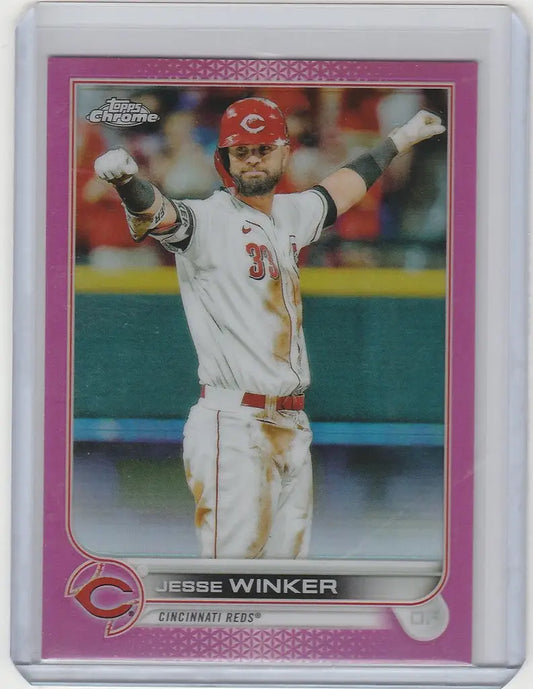 Baseball card of Jesse Winker pointing, featuring 2022 Topps Chrome Pink for Cincinnati Reds
