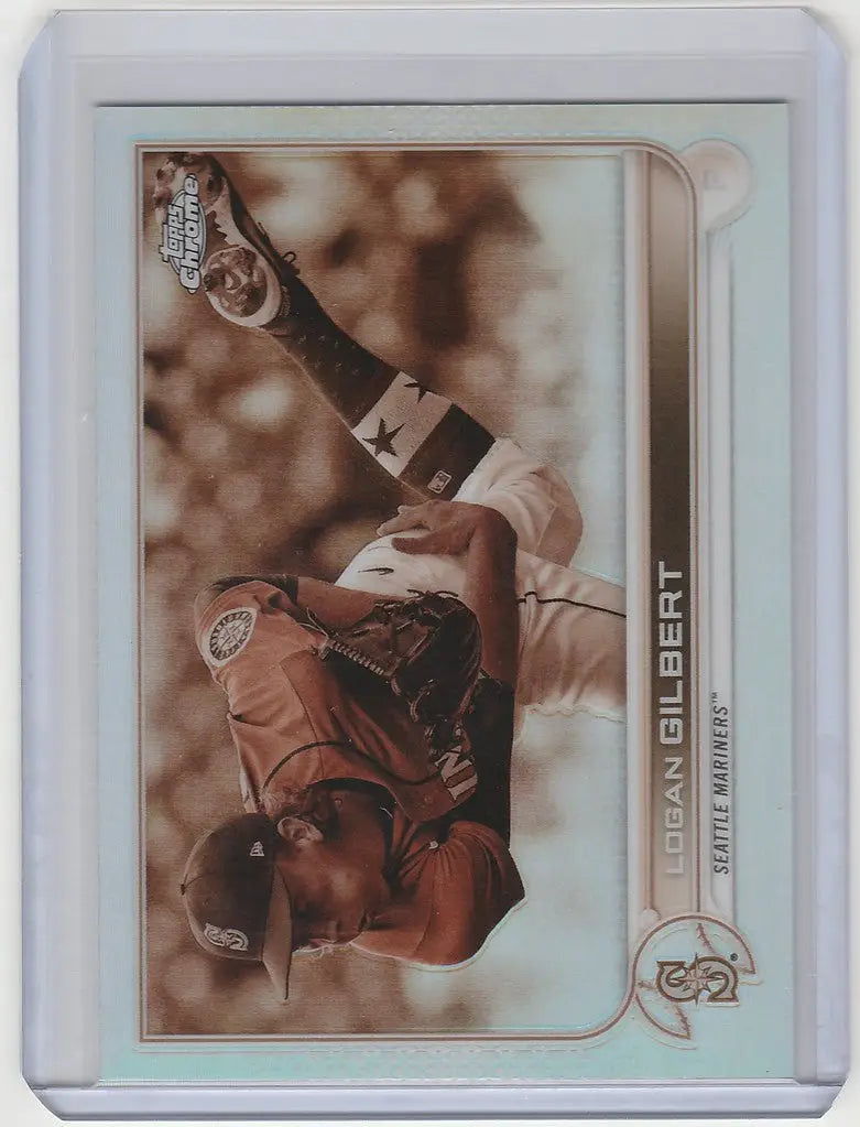 Baseball trading card of Logan Gilbert making a diving catch in Topps Chrome Sepia design