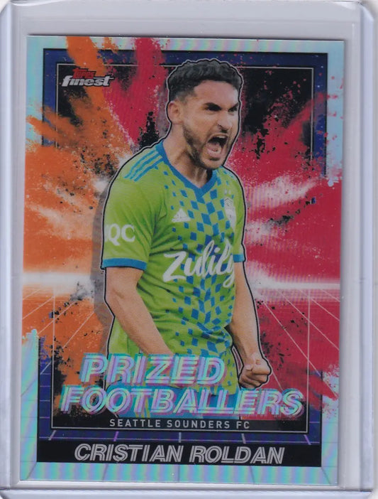 Soccer trading card of Cristian Roldan in green jersey, Topps Finest Prized Variation