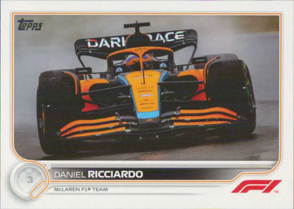 McLaren Formula 1 racing car in orange and black, featuring Daniel Ricciardo Topps Formula card