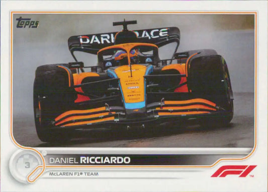 McLaren Formula 1 racing car in orange and black, featuring Daniel Ricciardo Topps Formula card
