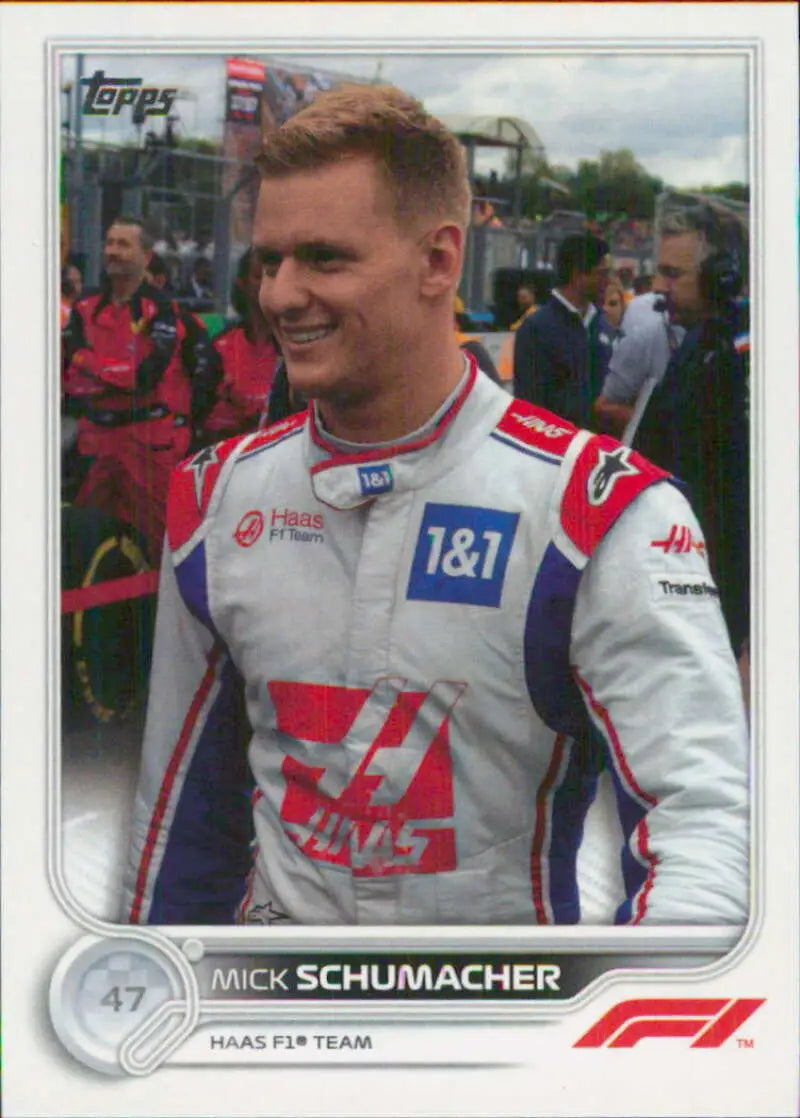 Mick Schumacher in a white Haas F1 Team suit featured on Topps Formula racing card