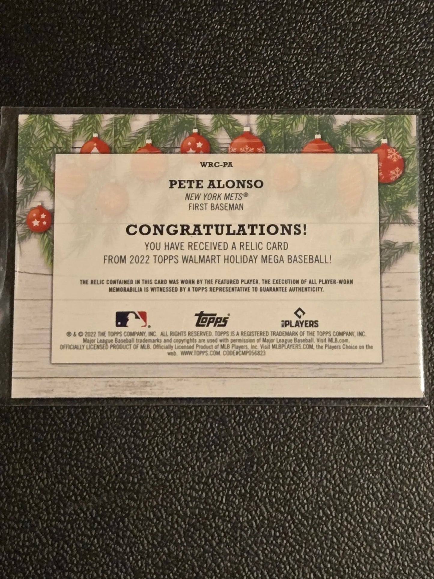 Commemorative Pete Alonso baseball card featuring Pete Alonso relics from 2022 Topps Holiday