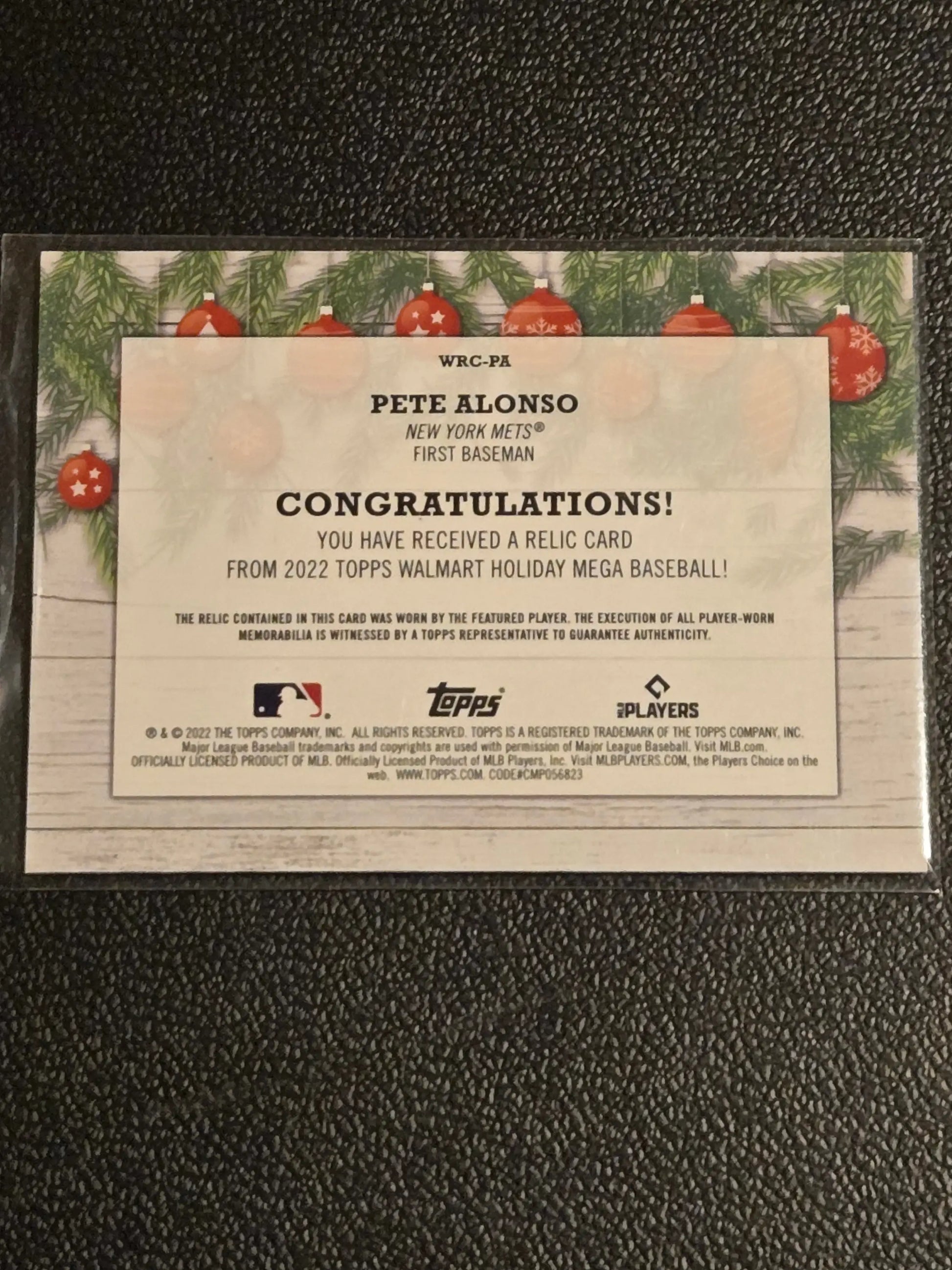 Commemorative Pete Alonso baseball card featuring Pete Alonso relics from 2022 Topps Holiday