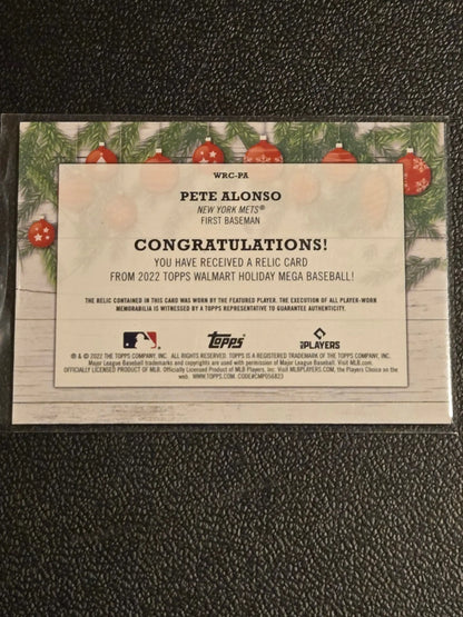 Commemorative Pete Alonso baseball card featuring Pete Alonso relics from 2022 Topps Holiday