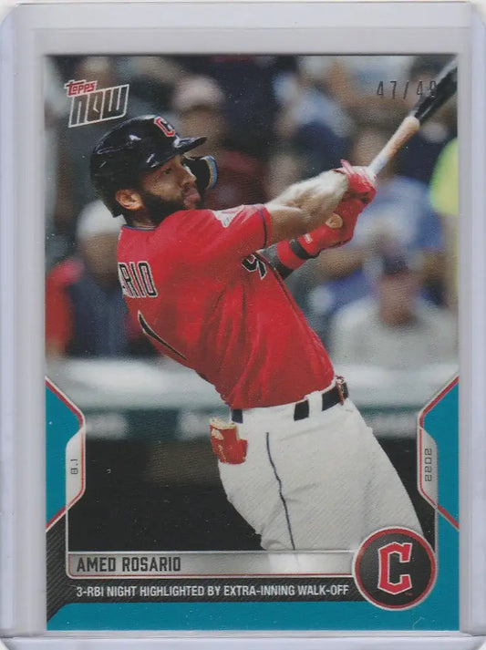Amed Rosario Cleveland Guardians baseball card in red jersey swinging bat
