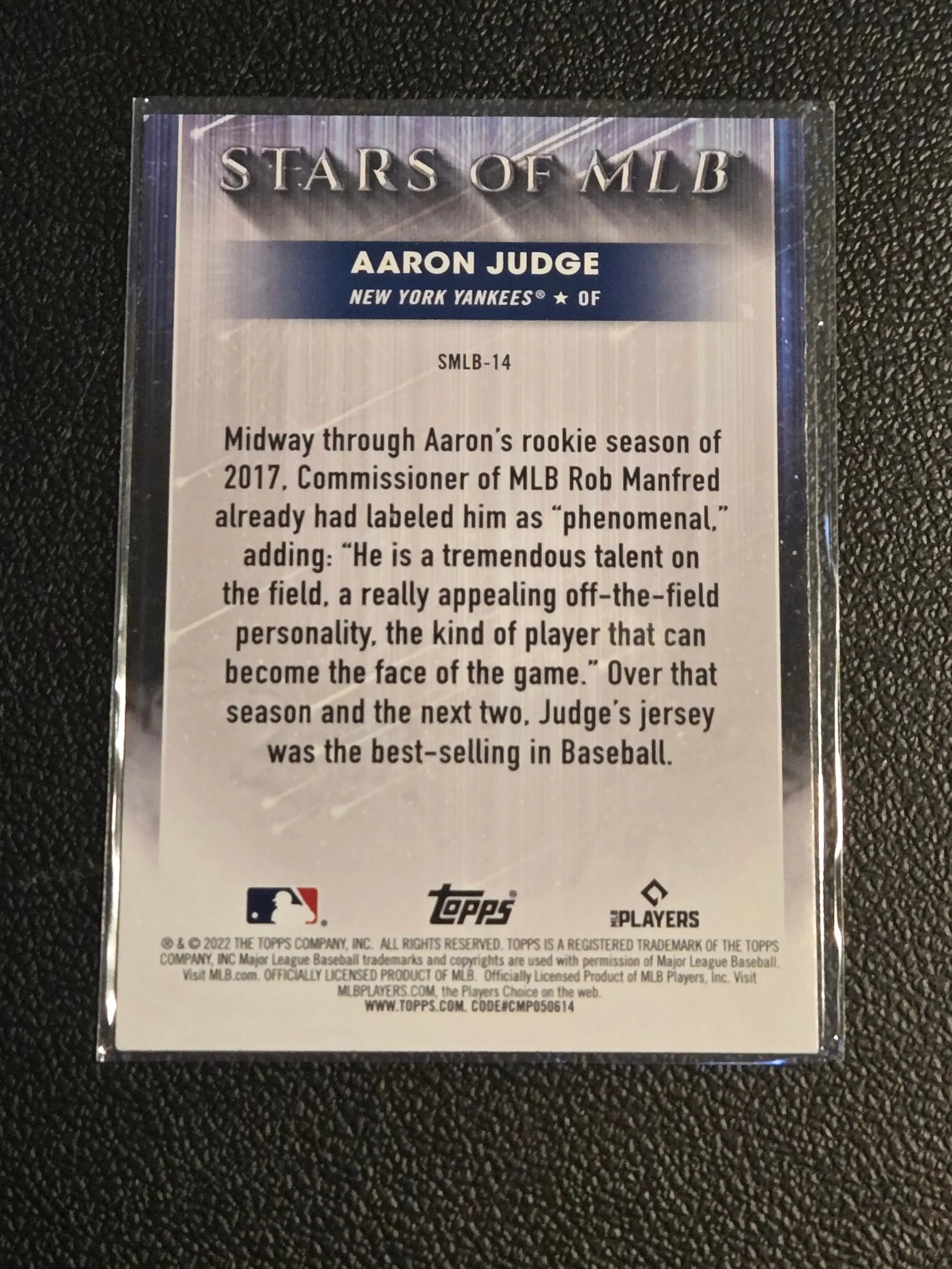 Baseball card featuring Aaron Judge Stars of MLB in protective sleeve, 2022 Topps judge stars