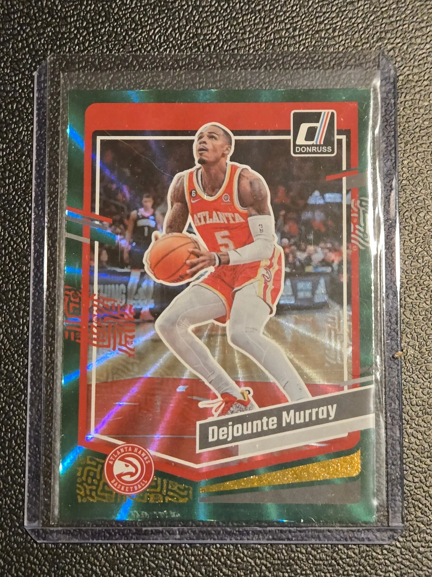 Dejounte Murray basketball card 2023-24 Donruss Murray Green Laser holo