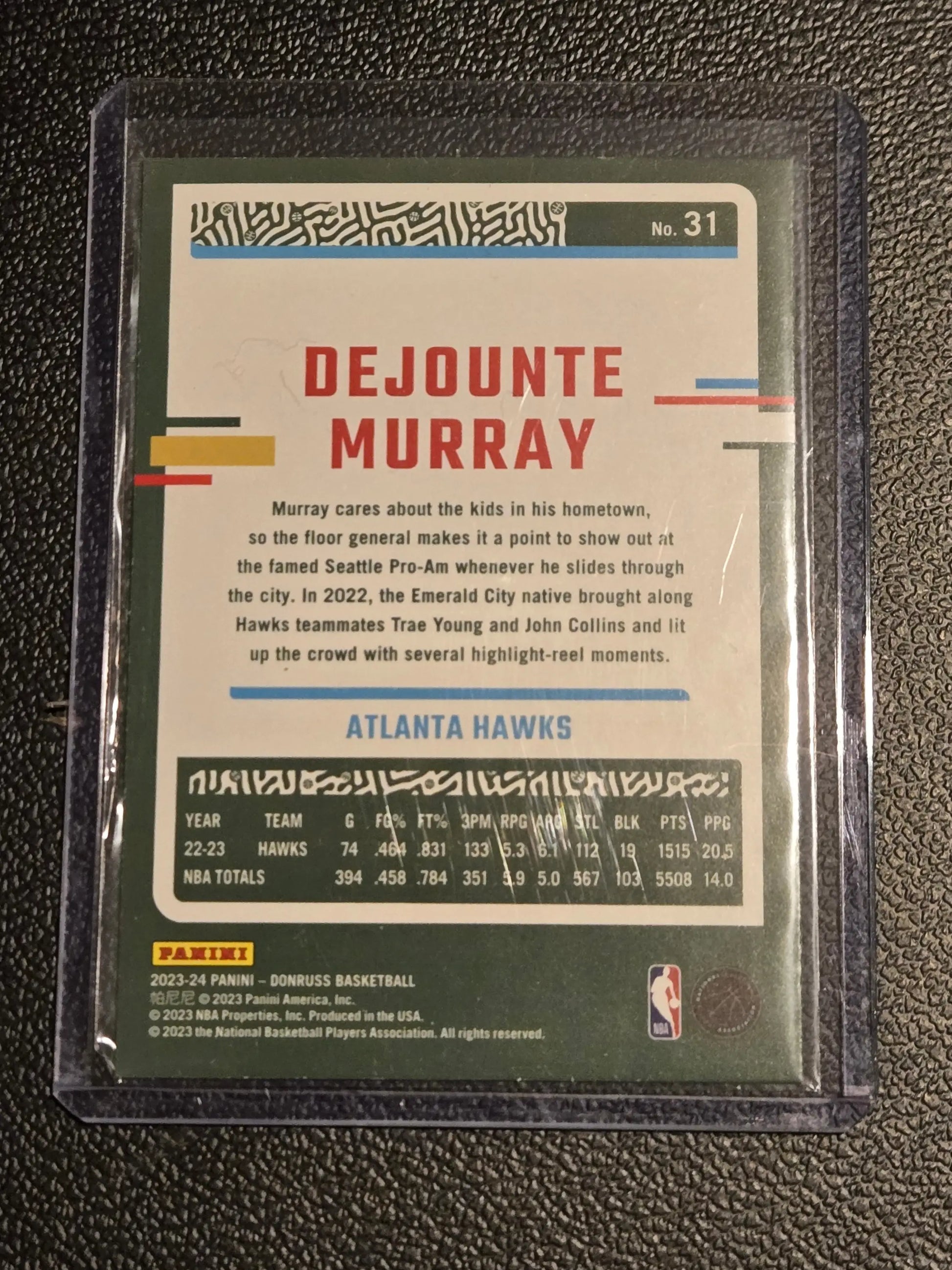 Dejounte Murray basketball card from 2023-24 Donruss featuring Green Laser Holo design