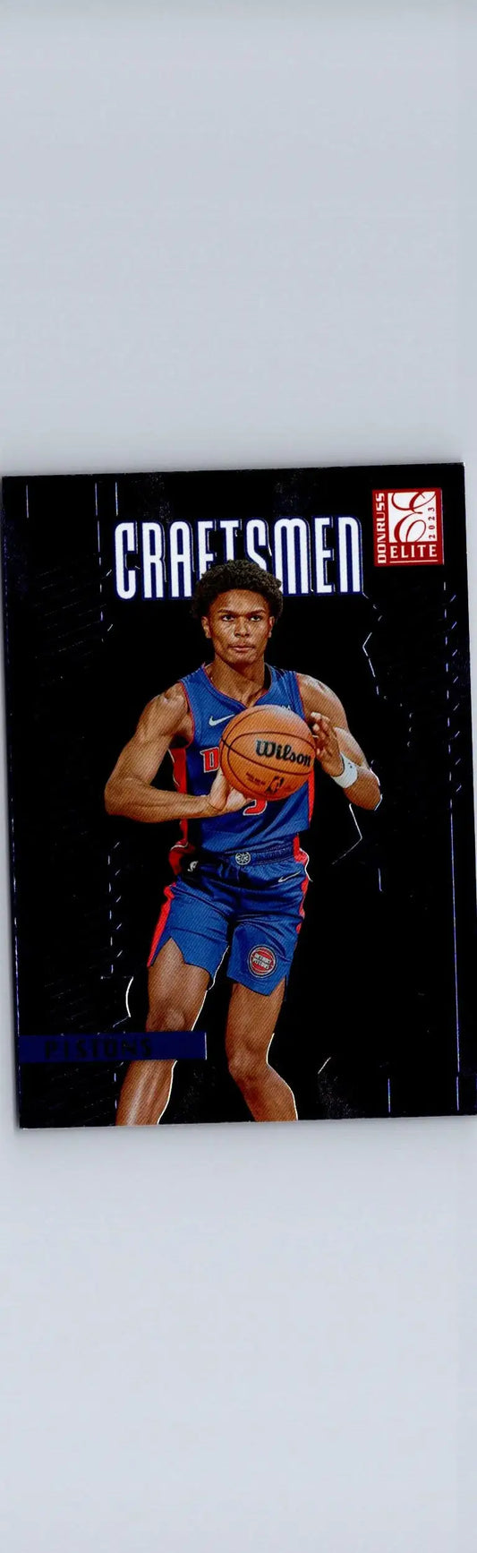 NBA basketball trading card featuring Ausar Thompson in blue and red uniform holding Wilson ball