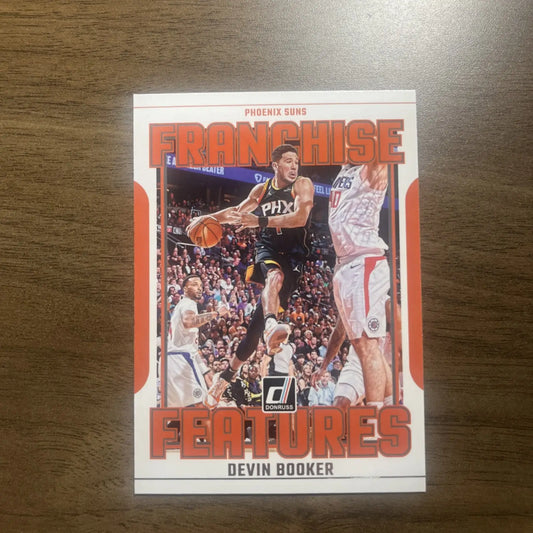 Devin Booker basketball card from 2023-24 Panini Donruss Franchise Features collection