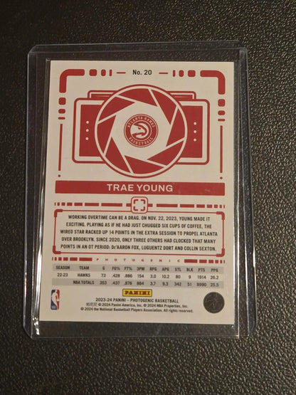 Red and white Trae Young basketball trading card from 2023-24 Panini Photogenic