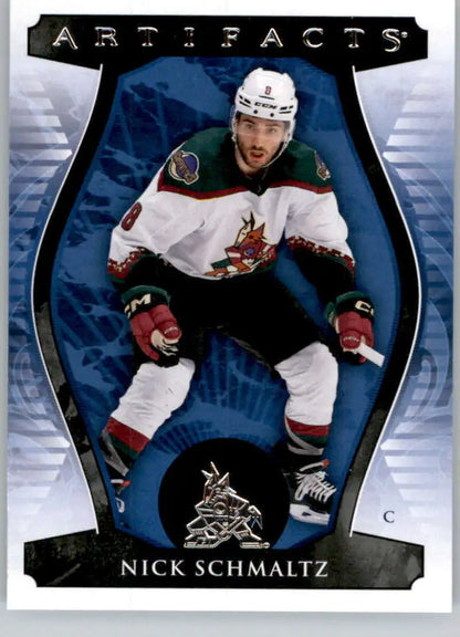 Hockey player in white Phoenix Coyotes jersey for Upper Deck Artifacts Nick Schmaltz card