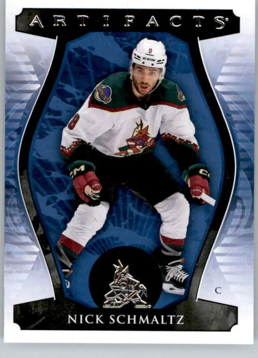 Hockey player in white Phoenix Coyotes jersey for Upper Deck Artifacts Nick Schmaltz card