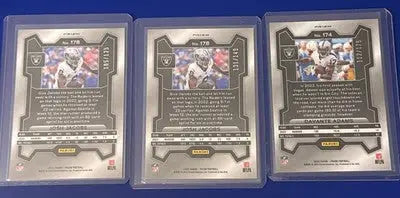 Three graded sports trading cards from the 2023 Josh Jacobs and Devante Adams Prizm Lot