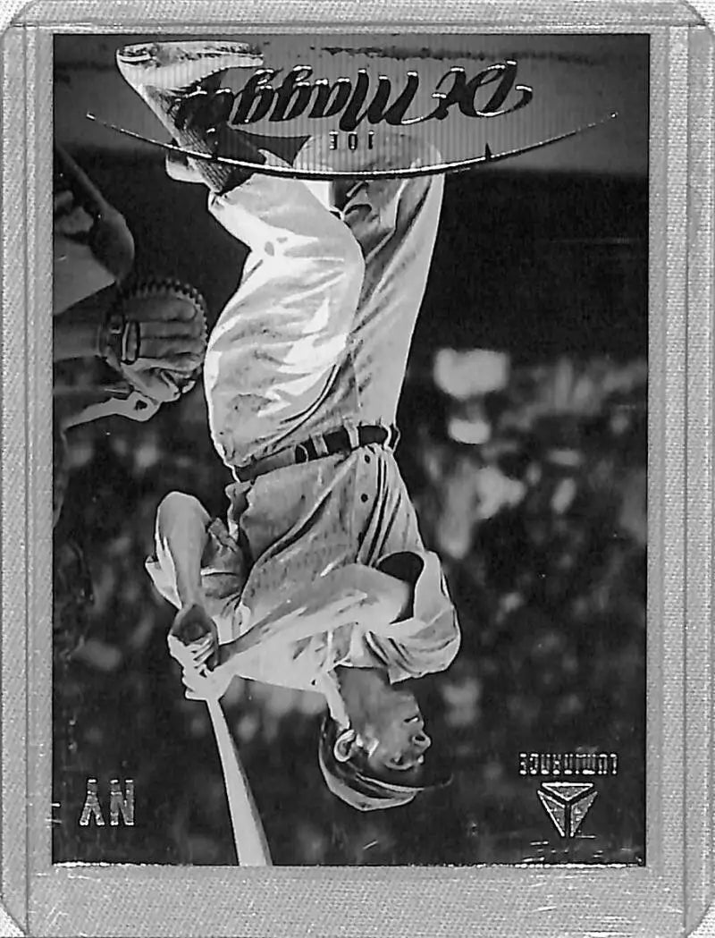Baseball player Joe DiMaggio flipping upside down in vintage black and white photo