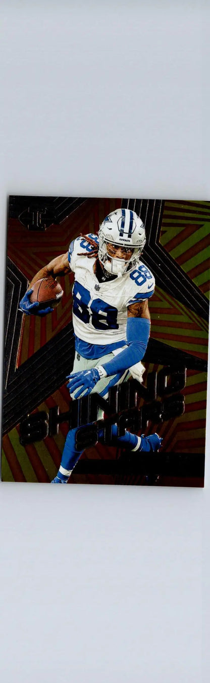 Football player trading card featuring CeeDee Lamb Shining Stars from 2023 Panini Illusions
