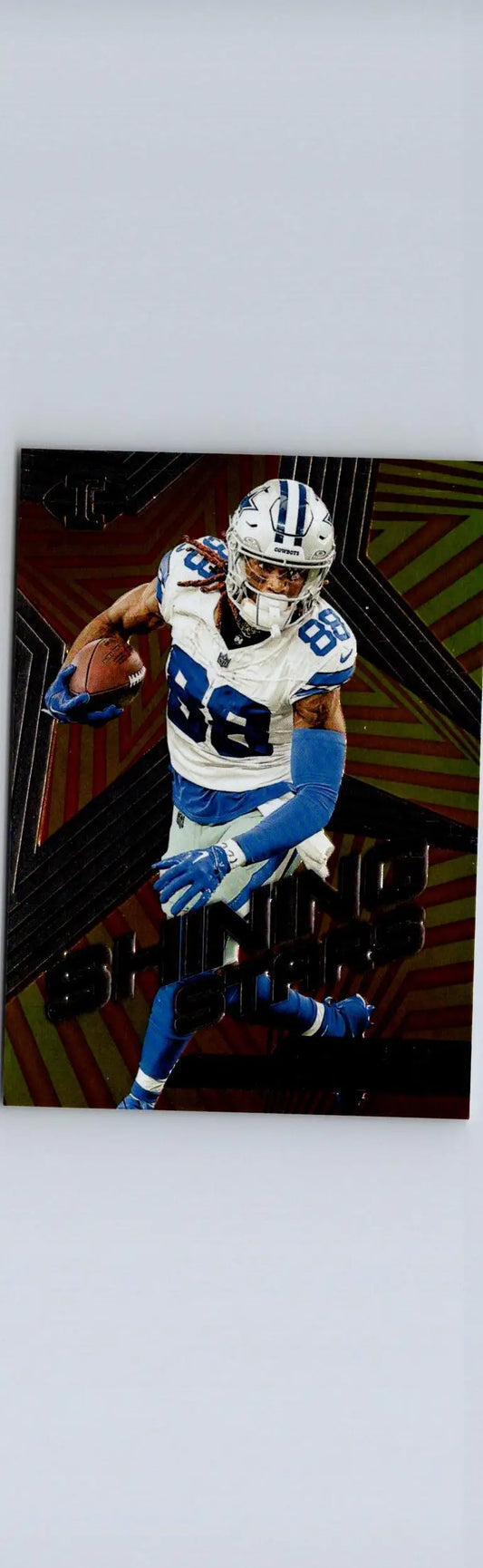 Football player trading card featuring CeeDee Lamb Shining Stars from 2023 Panini Illusions