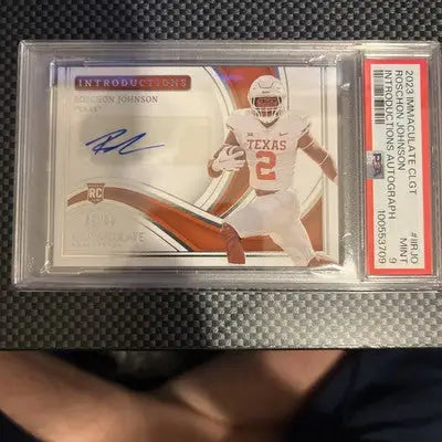 Graded Roschon Johnson Texas Longhorns football rookie autograph card from Panini Immaculate Collegiate