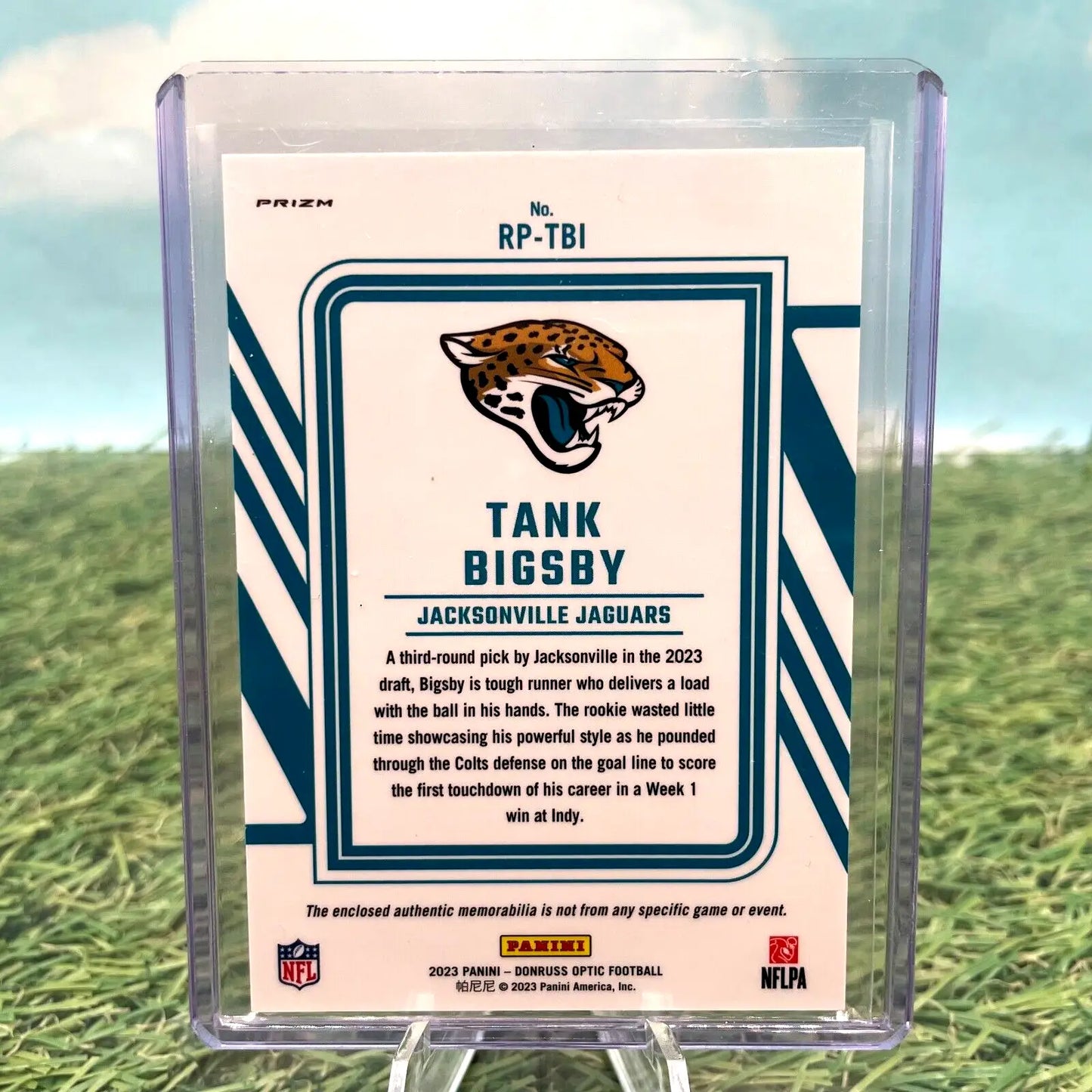 Tank Bigsby football card from 2023 Panini Optic Rookie Blue Hyper Prizm Rookie Phenom Relic