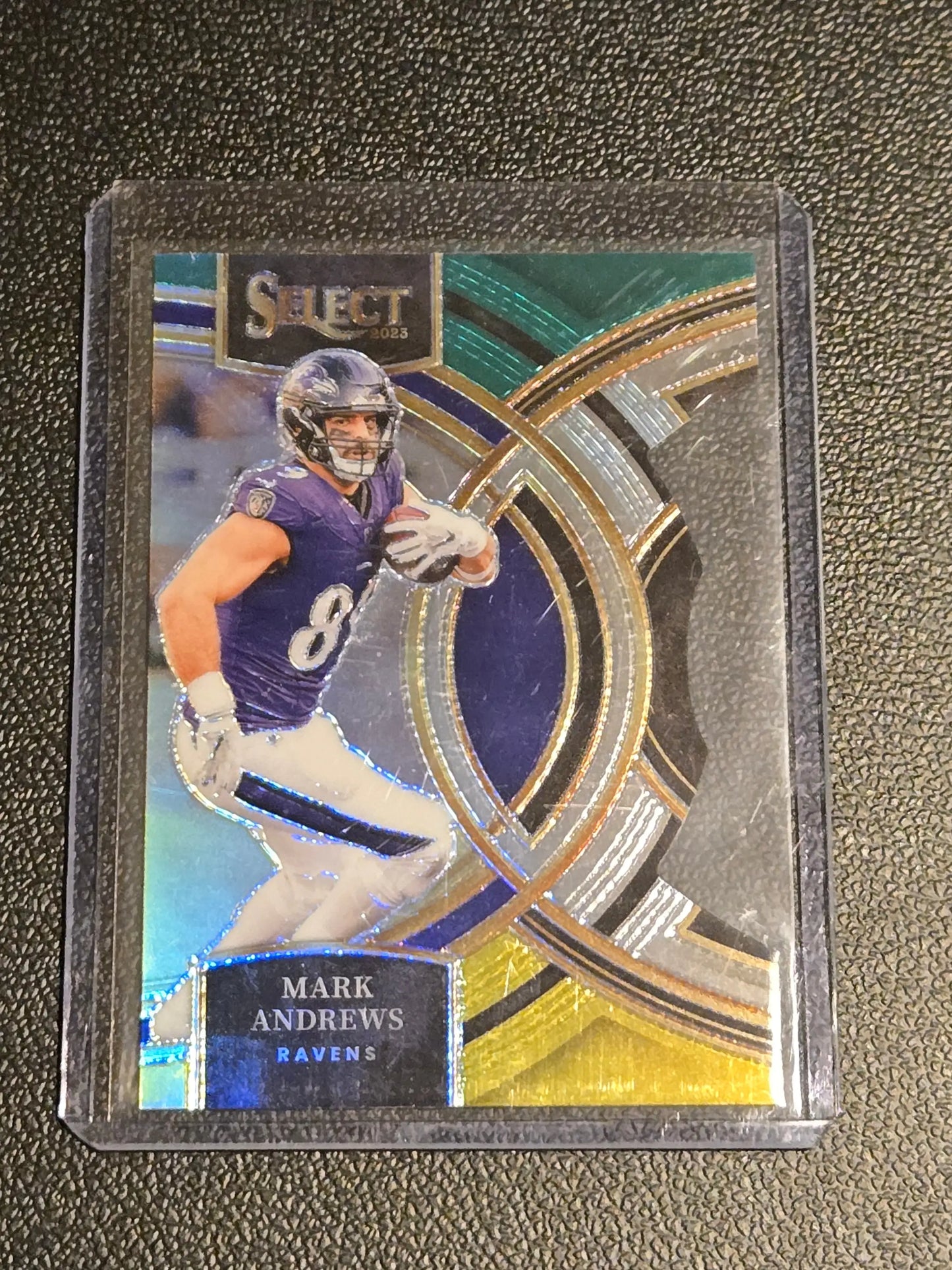 Mark Andrews football card with green and yellow prizms die cuts in 2023 Panini Select