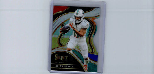 Football trading card of Jaylen Waddle Silver Prizms Die Cuts in protective sleeve
