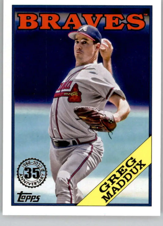Greg Maddux mid-throw in gray away uniform on Atlanta Braves baseball card