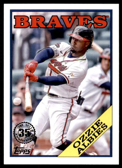 Ozzie Albies swinging a bat on a 2023 Topps Atlanta Braves Baseball Card