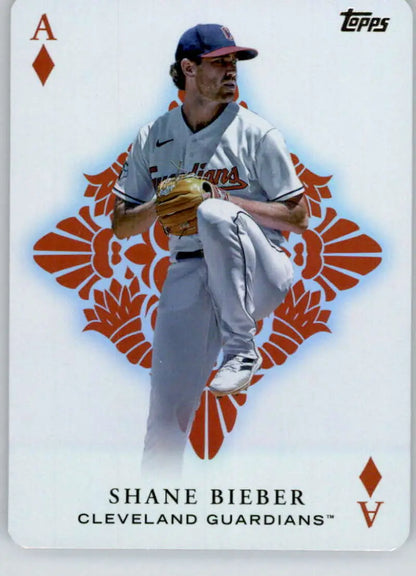 Shane Bieber pitching in action on a Cleveland Guardians baseball card with orange diamonds