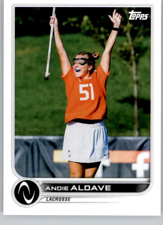 Andie Aldave celebrates in an orange jersey and white skirt on Topps Athletes Unlimited card