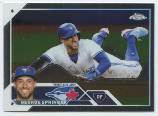 Toronto Blue Jays baseball card of George Springer sliding into base in 2023 Topps Chrome