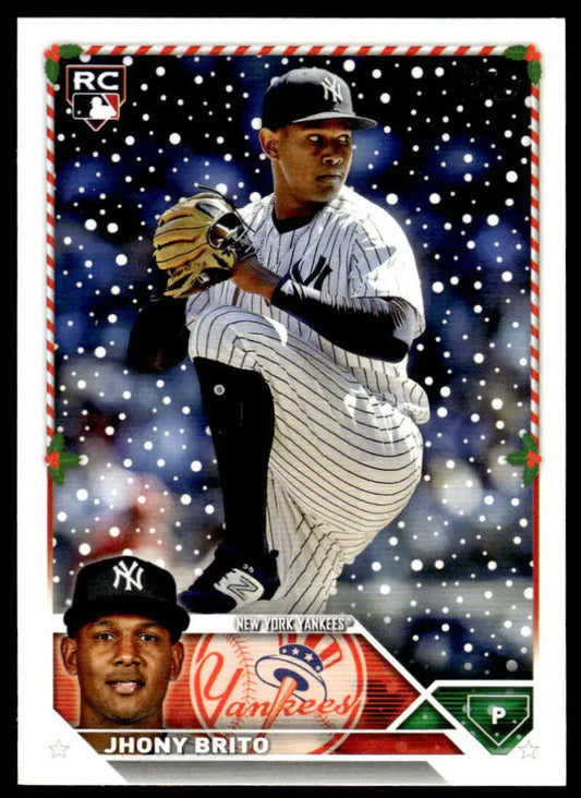 Baseball card of Jhony Brito in pinstripes windup, 2023 Topps Holiday collectible