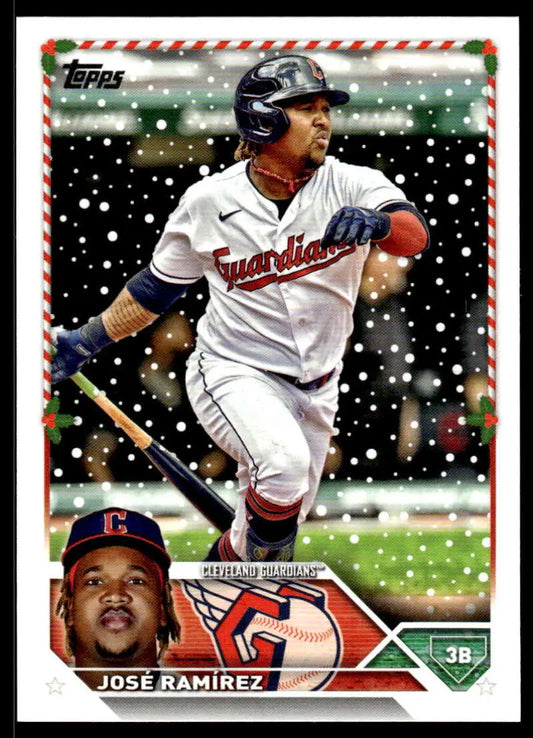 Baseball card of Jose Ramirez in white uniform at bat during snowy Cleveland Guardians game