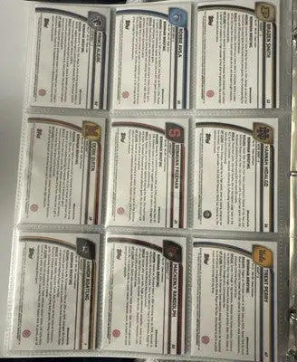 Collection of nine Bowman Chrome baseball trading cards in a clear binder for collectors