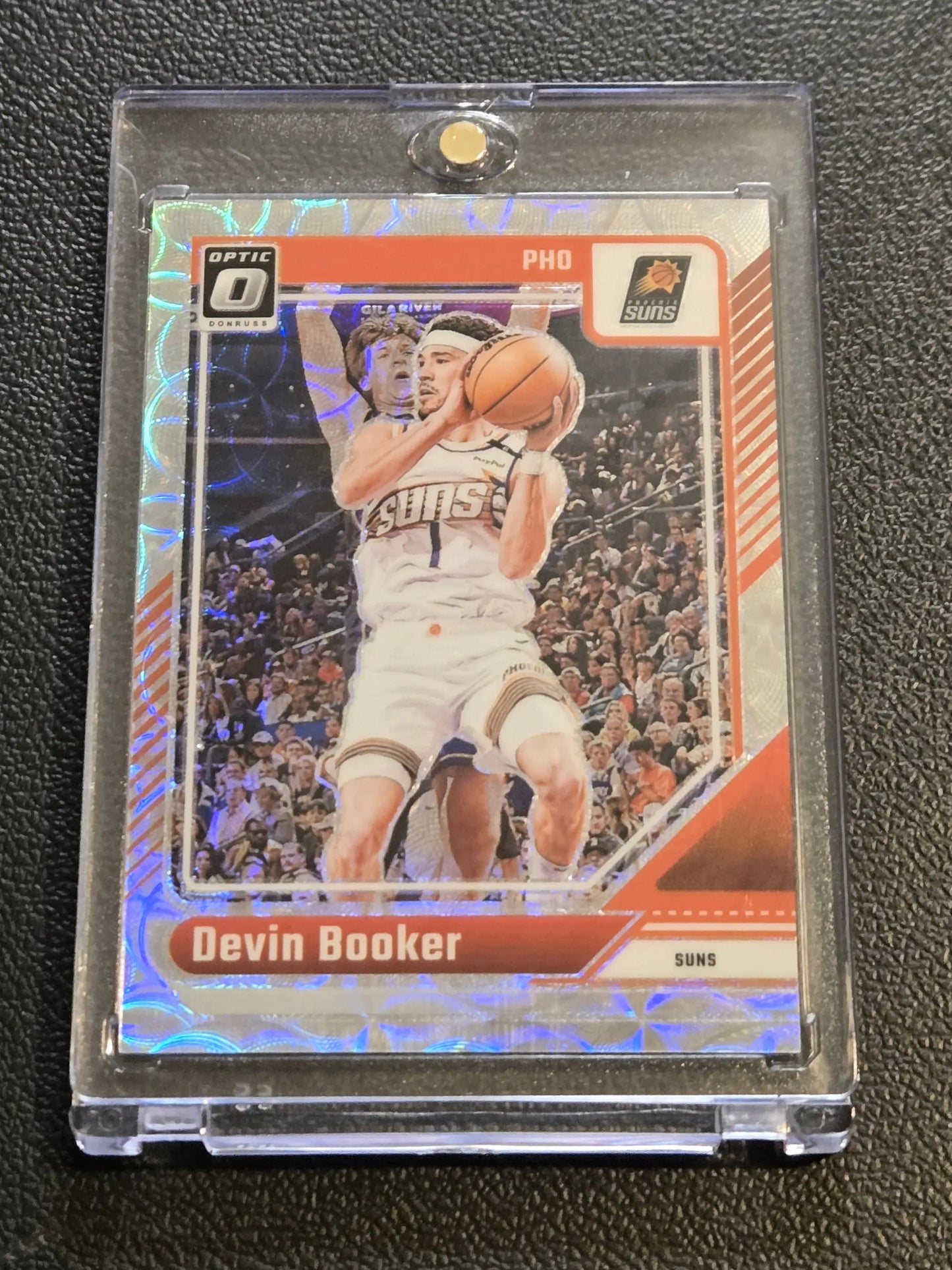 Devin Booker basketball card in protective case from 2024-25 Donruss Optic Booker Premium Box