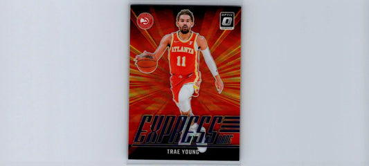 Basketball trading card featuring Trae Young in red Atlanta Hawks uniform with radiant background