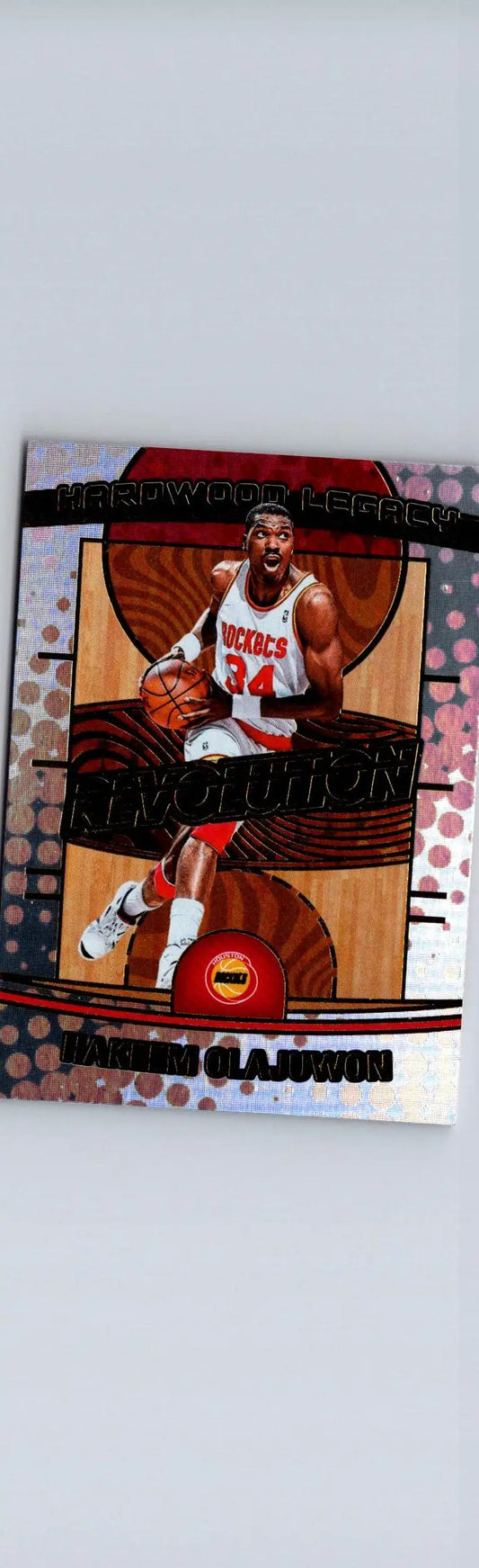 Basketball trading card of Hakeem Olajuwon in white and red uniform from Olajuwon Hardwood Legacy