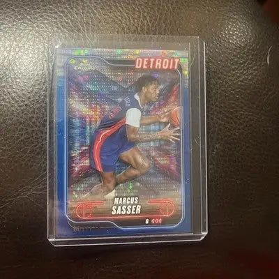Basketball trading card of Marcus Sasser with purple sonar refractor for Pistons in protective case