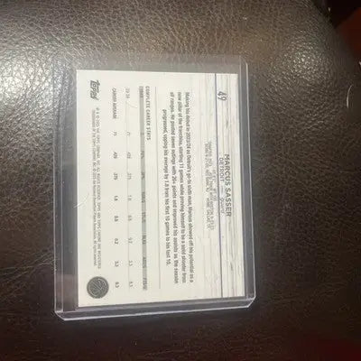 Trading card of Marcus Sasser in protective sleeve featuring 2024-25 Topps Chrome Purple Sonar Refractor