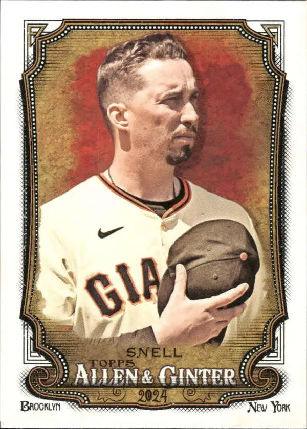 Baseball player Blake Snell in San Francisco Giants uniform holding baseball card