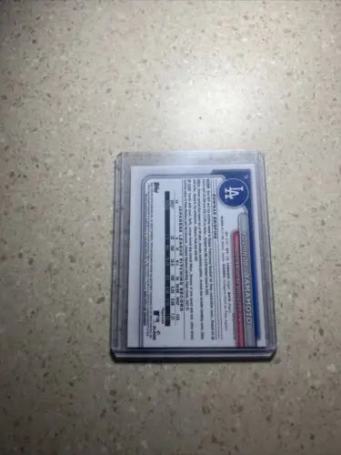 Baseball cards in protective cases featuring 2024 Bowman Chrome Yoshinobu Yamamoto RC