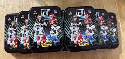 Collection of Donruss Football Holiday tins for football holiday card storage