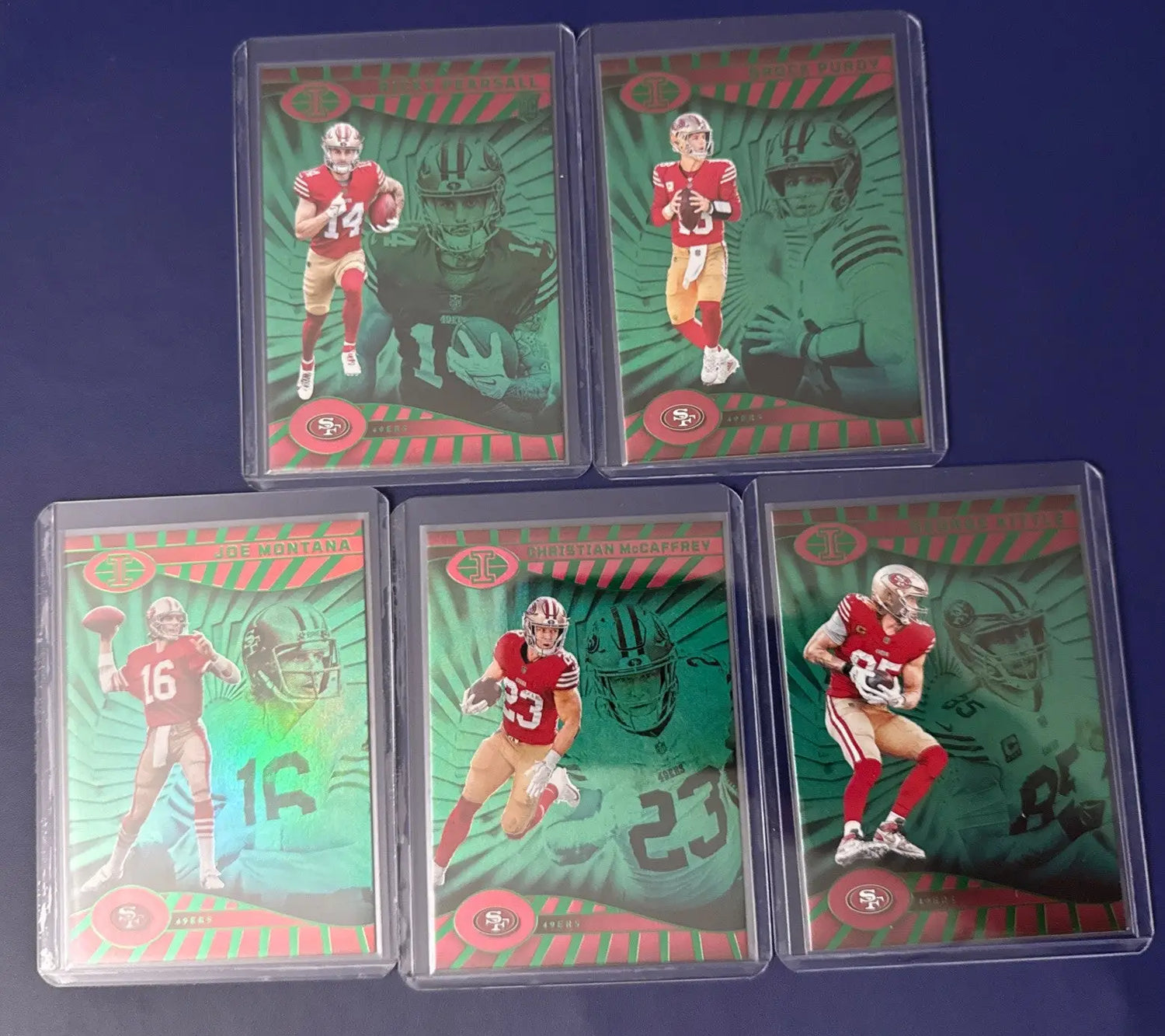 Collection of five illusions emerald green 49ers trading cards featuring Purdy Montana Kittle