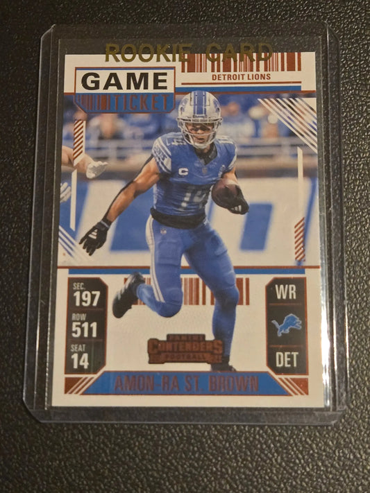 Football trading card featuring Amon-Ra St. Brown of the Detroit Lions, 2024 Panini Contenders game ticket red