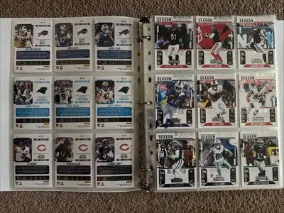 Open binder with Panini Contenders Football collectible trading cards showcasing a football complete set