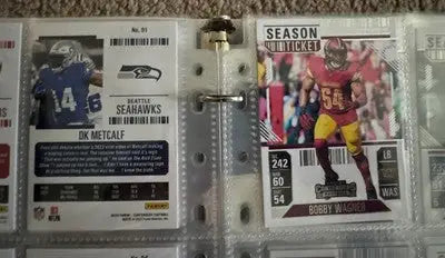 Two football trading cards in a clear sleeve from Panini Contenders Football complete set