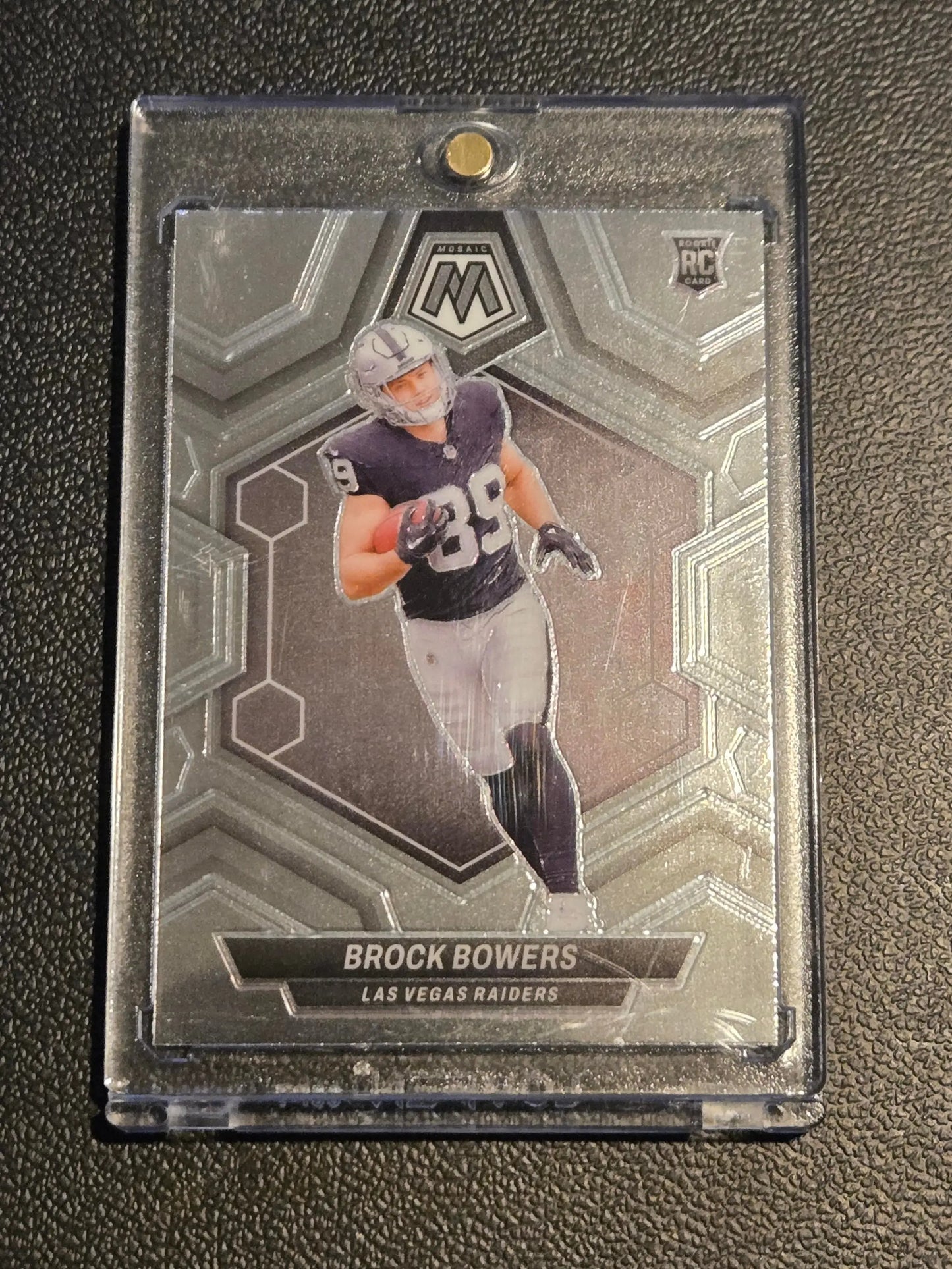Brock Bowers Panini Mosaic trading card in protective case Las Vegas Raiders 2024